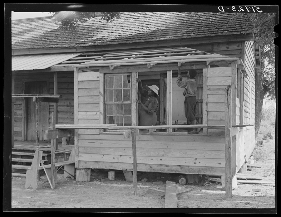 Pauline Clyburn, rehabilitation client, Manning, Clarendon County, South Carolina, and her son repairing home