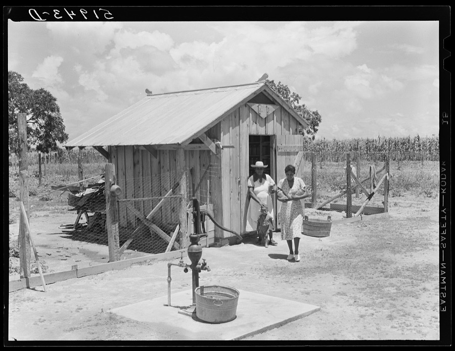 Daughter of Frederick Oliver, tenant purchase client, bringing canned goods in from smokehouse. Summerton, South Carolina