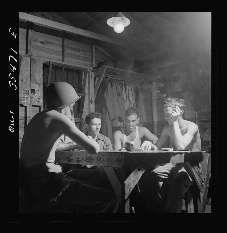 Greenville, South Carolina. Air Service Command. Men of the Quartermaster Truck Company of the 25th service group having a card game in one of the barracks