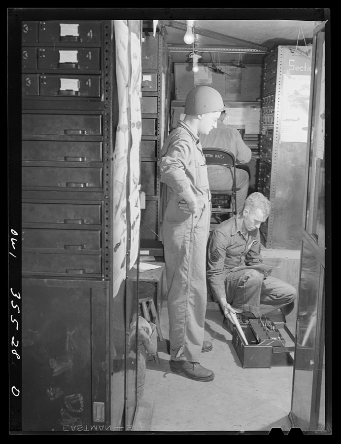 Greenville, South Carolina. Air Service Command. Sergeant John Riley of the 25th service group getting his tools and kit at the supply trailer of the 35th service squadron