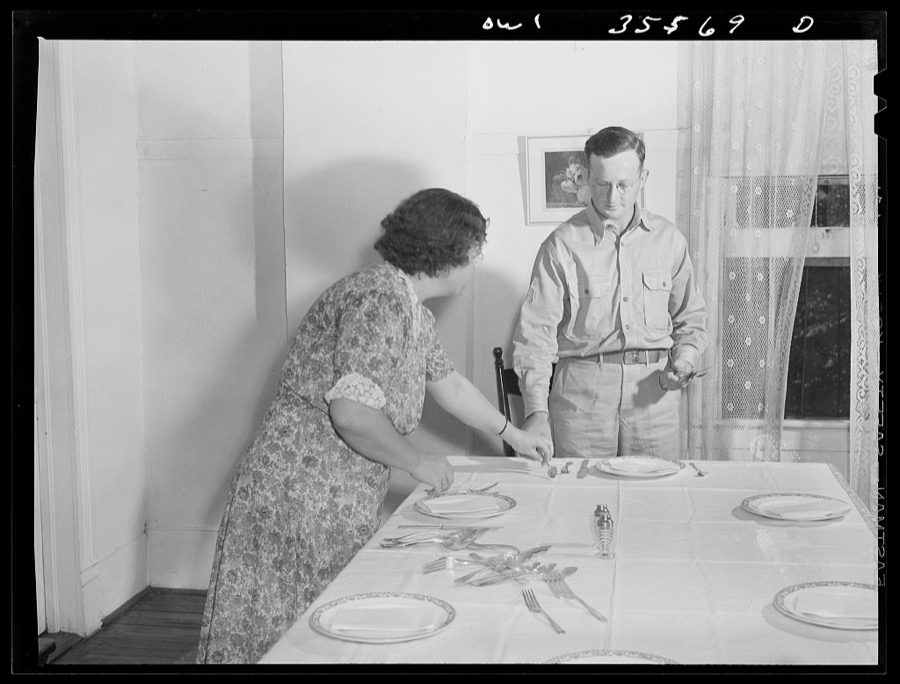 Bowman, South Carolina. Sergeant John Riley, of the 25th service group, Air Service Command, home on leave having dinner with his family and a friend