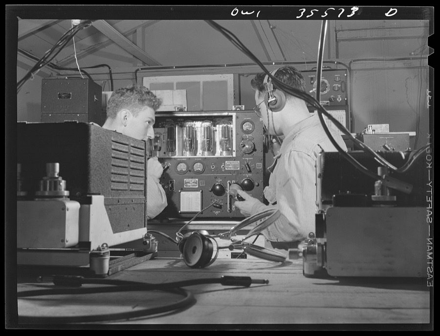 Greenville, South Carolina. Air Service Command. Men of the 1067th signal company of the 25th service group, checking the calibration of an airborn radio transmitter. Left is Private Lester Mehlmen, of 1319 Carmen Street, Chicago, Illinois, and right, Private Charles Nasopust, 2222 South Hainsworth Street, North Riverside, Illinois