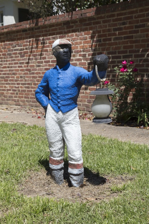 A so-called black "lawn jockey" in Aiken, South Carolina. These figures of an African-American figure in jockey attire have diminished in number across the United States, or even been painted over to depict the jockey as white, in response to allegations that the figures are remnants of a racist past