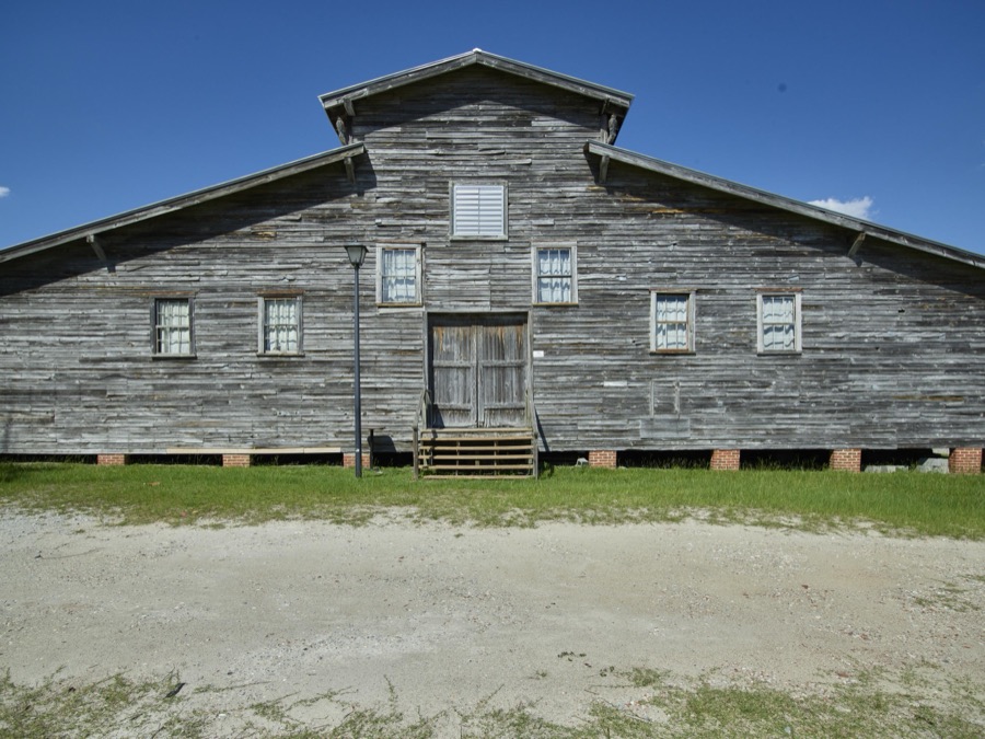 The old peanut warehouse, now an entertainment venue, is a landmark in Conway, South Carolina. Built in 1900 to store peanuts and fertilizer, it was later used as a tobacco barn