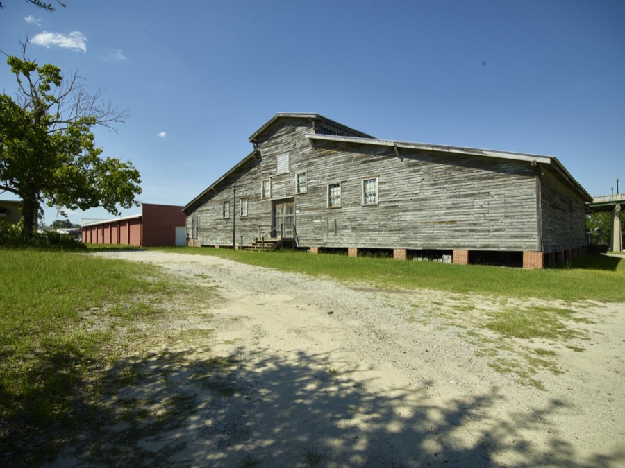 The old peanut warehouse, now an entertainment venue, is a landmark in Conway, South Carolina. Built in 1900 to store peanuts and fertilizer, it was later used as a tobacco barn