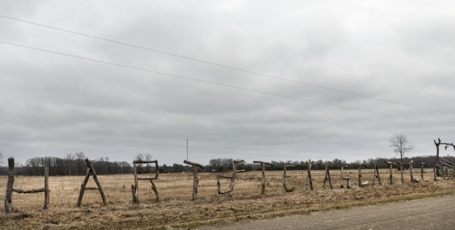 On a wire fence on this ranch near Texarkana, Texas, branches spell out, or in this case partially misspell out, the spread's name and what it raises
