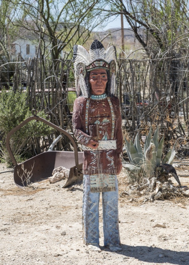 A carved indian figure near the "ghost town," some of which is still occupied and some of which consists of ruins of the Chisos quicksilver-mining company which operated from 1905 into the early 1940s, and the residences of those who worked there. Terlingua, Texas