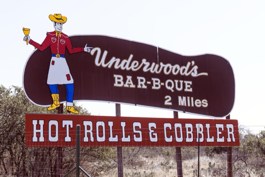 Street sign for a barbecue restaurant in Brownwood, the seat of Brown County in Central Texas. Texas vies with North Carolina and the city of Kansas City as avowed "barbecue capitals" of the country