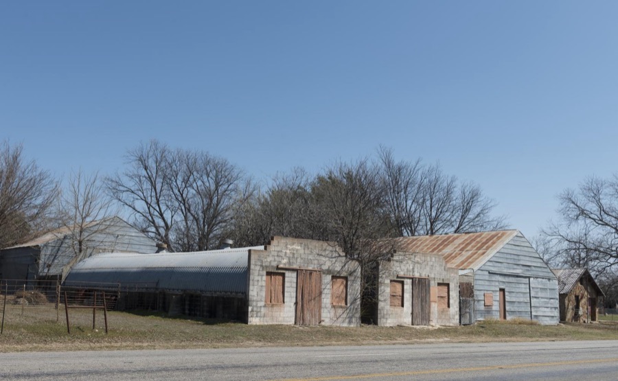 Old roadside buildings, including a partial quonset structure, in Zephyr, an unincorporated town in Brown County, Texas