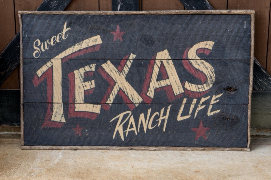 Sign "Sweet Texas Ranch Life" at the 1,800-acre Lonesome Pine Ranch, a working cattle ranch that is part of the Texas Ranch Life ranch resort near Chappell Hill in Austin County, Texas