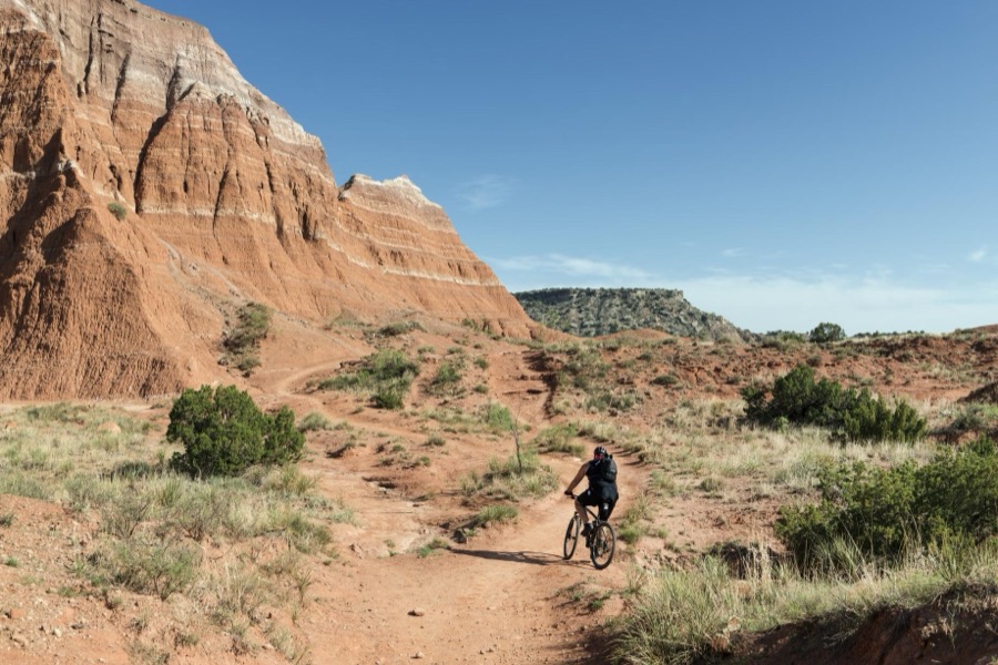 A mountain biker tests a rugged path amid the rock formations in Palo Duro Canyon State Park in the Texas panhandle