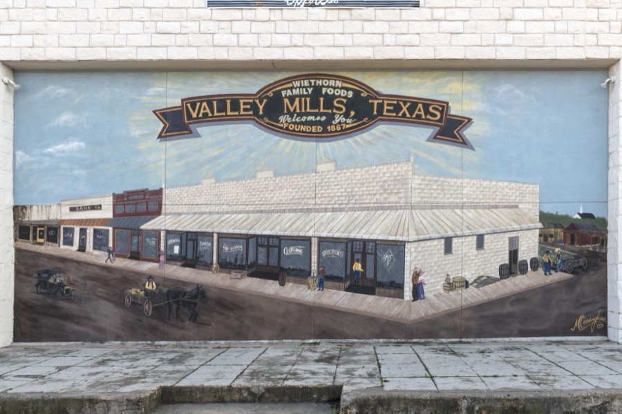 A 2007 mural, "Wiethorn Family Foods, Valley Mills, Texas, Welcomes You, Founded 1867," by M. Cunningham in Valley Mills, Texas, depicting an earlier time in the Bosque County town