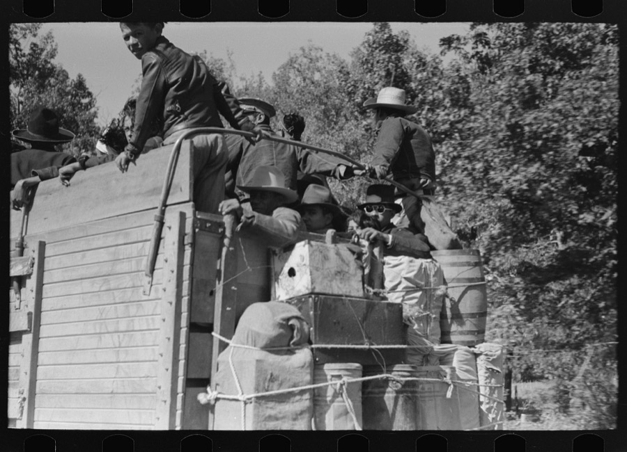 Truckload of Mexican migrants returning from Mississippi where they had been picking cotton. Highway near Neches, Texas, Anderson County