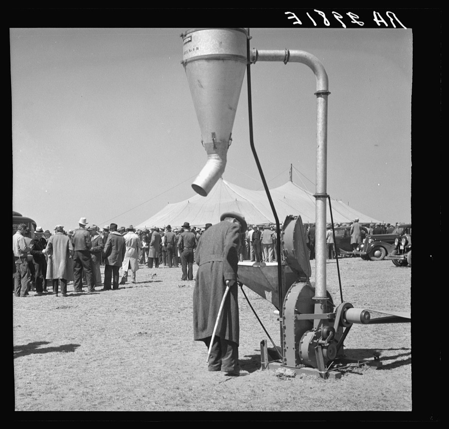 Examining farm machinery. Farm implement show. Carson County, Texas