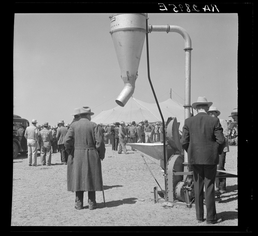 Examining farm machinery. Farm implement show. Carson County, Texas