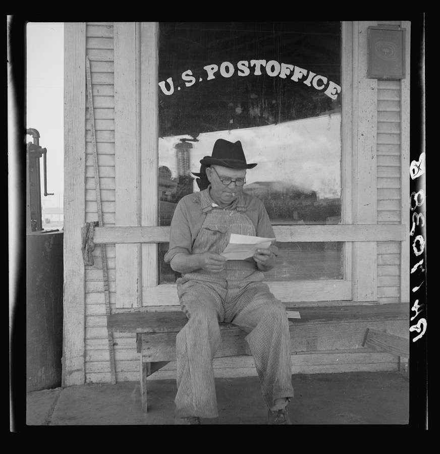 Man in front of post office. Carey, Texas. This town is fast becoming a ghost town because of mechanization of cotton and displacement of tenant farmers