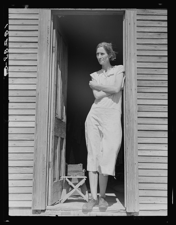 Migratory laborer's wife with three children (not in photo). Near Childress, Texas