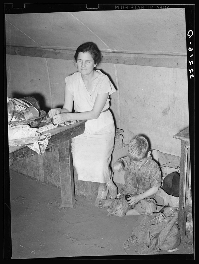 White migrant mother and son in tent home near Harlingen, Texas. See 32108-D