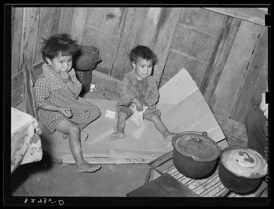 Mexican children in kitchen. San Antonio, Texas