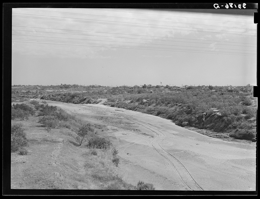 Wagon tracks down the dry bed of the Colorado River at Colorado, Texas. Rivers and streams of the Southwest are often dry during periods of drought