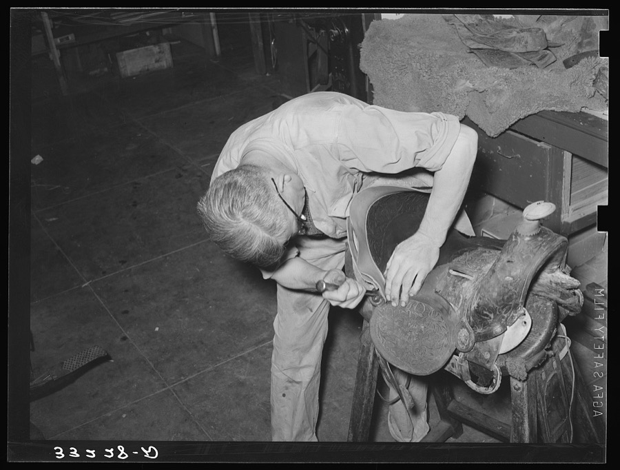 Repairing saddle. Alpine, Texas, saddle shop