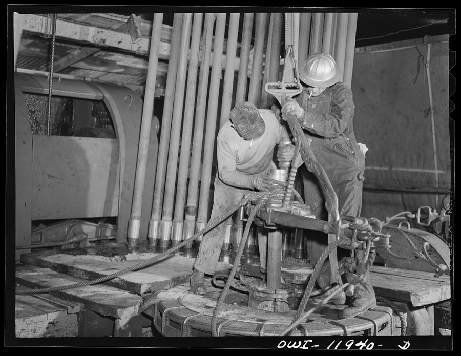 Andrews County, Texas. Pulling pipe out of well at night