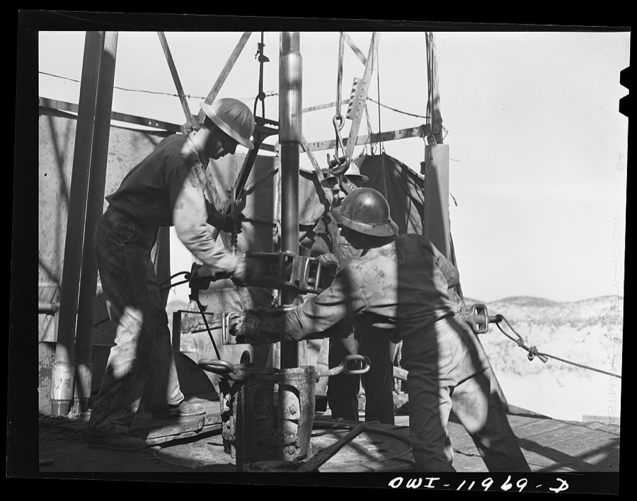Andrews County, Texas. Attaching new bit to the drill pipe