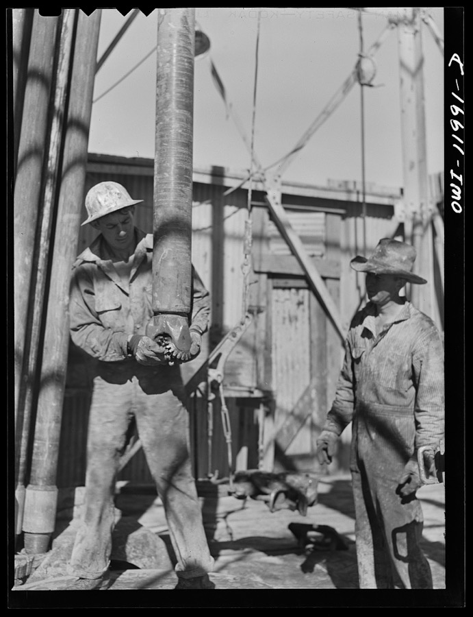 Andrews County, Texas. Attaching new bit to the drill pipe