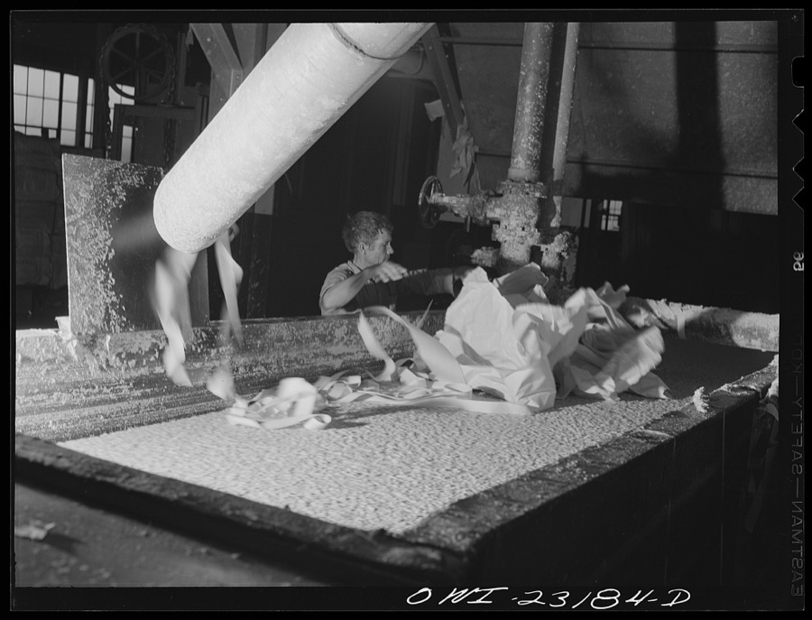Lufkin, Texas. Southland paper mill. Trimmed edges of cut newsprint rolls blowing into a vat where they are converted back into stock