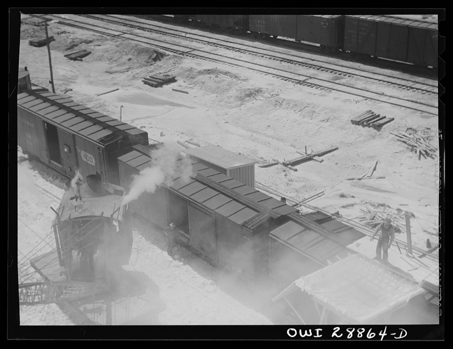 Freeport Sulphur Company, Hoskins Mound, Texas. Hopper with which boxcars are loaded with sulphur