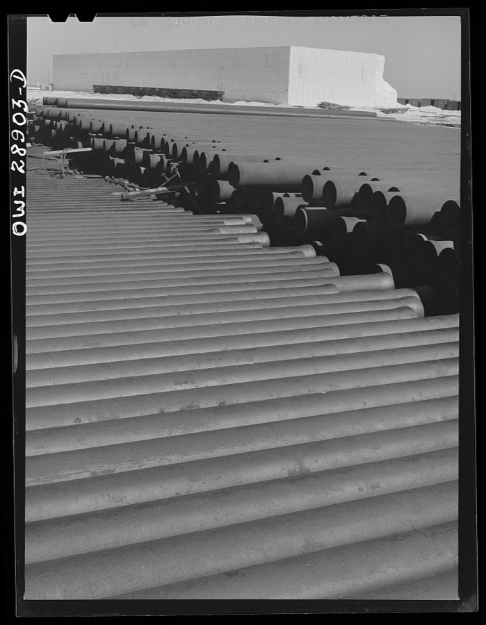 Freeport Sulphur Company. Hoskins Mound, Texas. Pipe storage. Pipelines are laid for carrying superheated water to the wells and for carrying melted sulphur to relay stations and to the vats