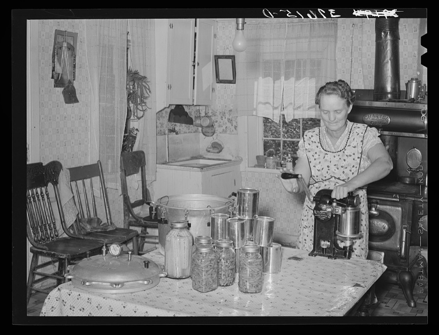 Mrs. Christiansen of the Christiansen canning unit sealing cans. During 1939 she canned 2300 quarts which included 20 mutton, 2 deer, 2 beeves, 5 pigs. Fish was tried very successfully. In this cooperative agreement there were twenty-five users and outside of the cooperative there were ten others who used Mrs. Christiansen's services