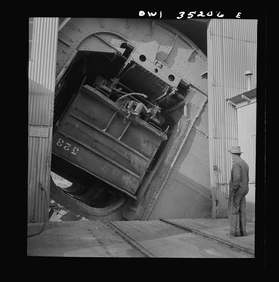 Magna, Utah. A rotary car dumper discharging copper ore at the mill