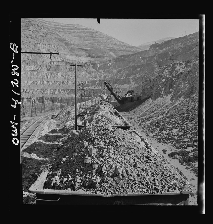 Bingham Canyon, Utah. Looking over the tops of cars loaded with ore at an open-pit mine of the Utah Copper Company