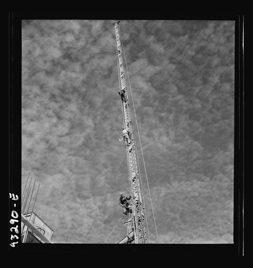 Columbia Steel Company at Geneva, Utah. Surveyor running lines for a water intake tunnel to serve a new steel mill under construction which will make important additions to the vast amount of steel needed for the war effort