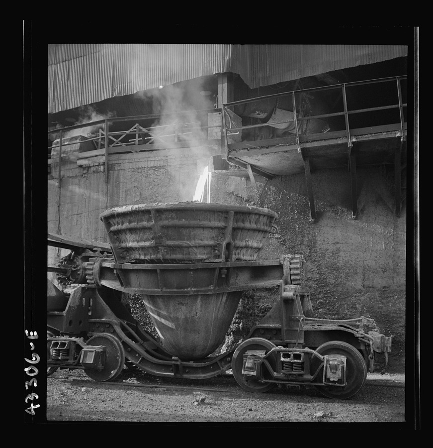 Columbia Steel Company at Ironton, Utah. Tapping a blast furnace for an iron cast