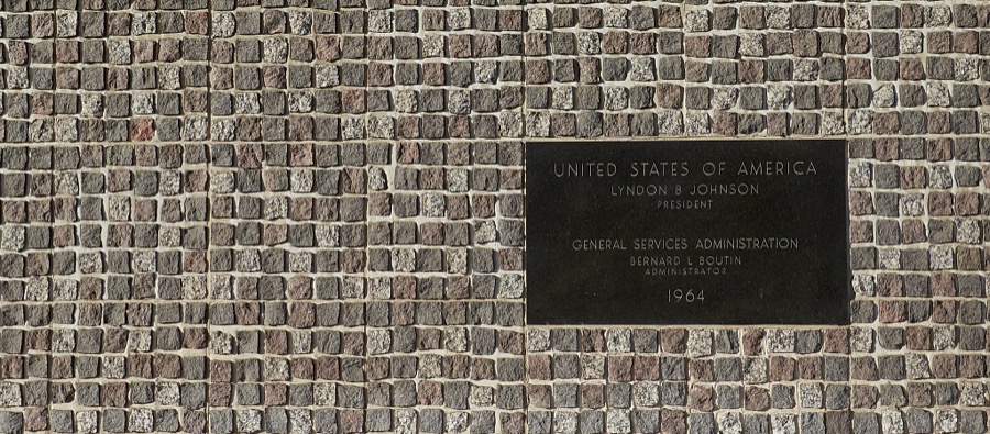 Placque, James V. Hansen Federal Building, originally the Federal Building United States Court House, is constructed in the Modernist style is a six story structure located at the northeast corner of Grant Ave. and 25th St in Ogden, Utah