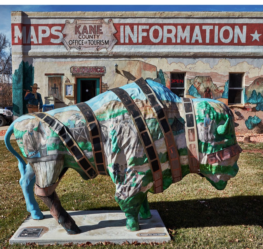 The Kane County Tourism Office in Kanab, a small city on the Arizona border in southern Utah, doesn't just talk or give visitors brochures about the town's rich history as the gathering place for producers, actors, and crews producing iconic western movies in the colorful canyons nearby, it illustrates that tradition on its exterior walls too