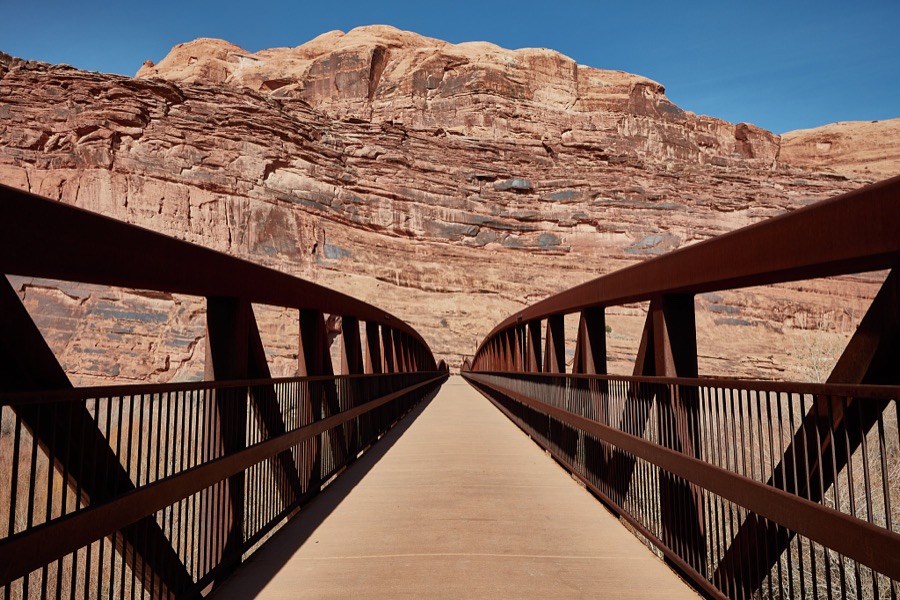 This pedestrian bridge crosses the winding Colorado River near Moab, the gateway city to the stunning red-rock formations of Arches and Canyonlands national parks and other archeologically rich areas near the Colorado border in the western U.S. state of Utah