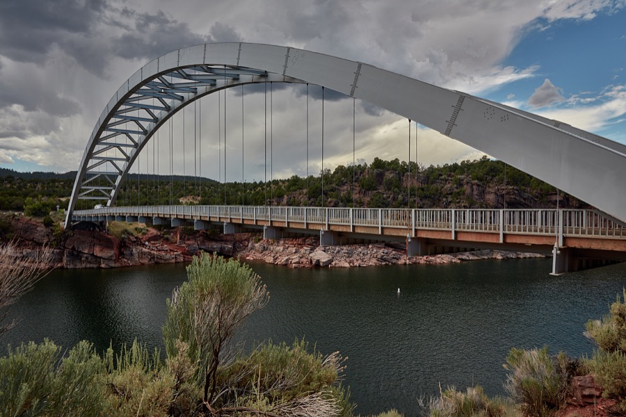 View of the Flaming Gorge Arch Bridge, built in 1962, which carries U.S. Highway 191 over the Flaming Gorge Reservoir, which impounds the water of the Green River in desolate Daggett County, the north easternmost county in the western state of Utah