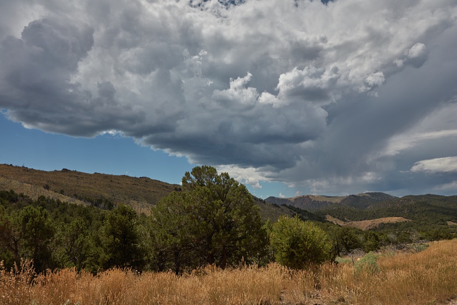 Roiling clouds meet rock formations in rugged, lightly populated Daggett County in the north easternmost corner of the western state of Utah