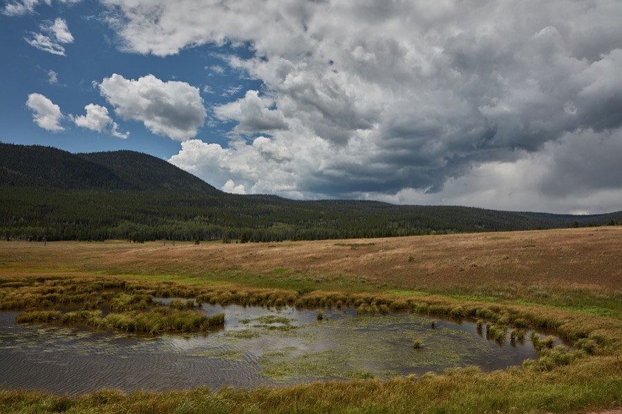 A pond accents the landscape in rugged, lightly populated Daggett County in the north easternmost corner of the western state of Utah