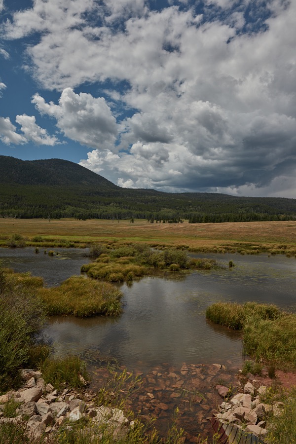 A pond accents the landscape in rugged, lightly populated Daggett County in the north easternmost corner of the western state of Utah