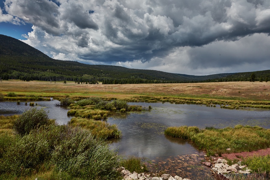 A pond accents the landscape in rugged, lightly populated Daggett County in the north easternmost corner of the western state of Utah