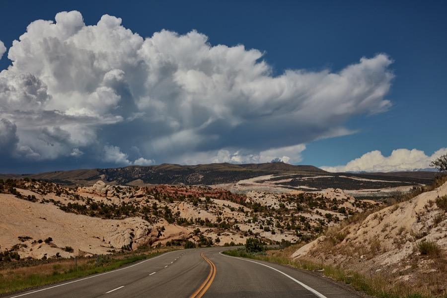 A highway begins its descent in the Uinta Mountains of Uintah County, near the Colorado border in northeast Utah, gradually turns from flaming red to creamy caramel