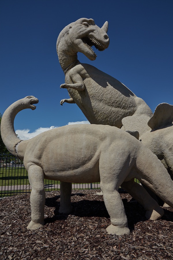 Murals, art figures, and sculptures of fearsome dinosaurs such as this in a city park are not unusual in the small city of Vernal in eastern Utah's Uintah County