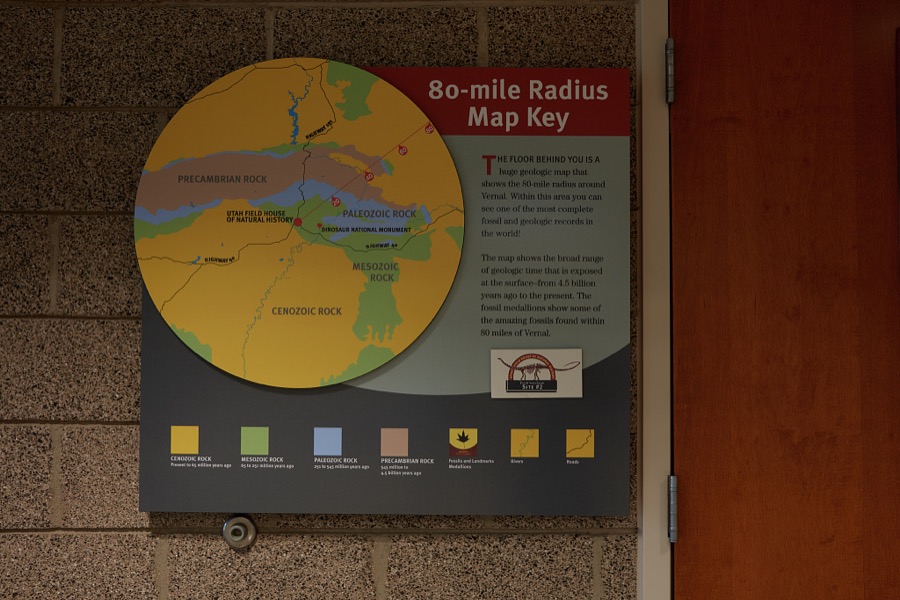 A sign calling attention to a floor map at the Utah Field House of Natural History State Park Museum in the small city of Vernal in eastern Utah's Uintah County that highlights the extensive radius of dinosaur-bone discoveries in the region