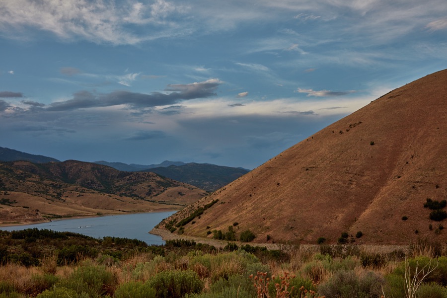Dark skies give an extra glow to the hills above Deer Creek Reservoir, near Wallsburg in Wasatch County, Utah