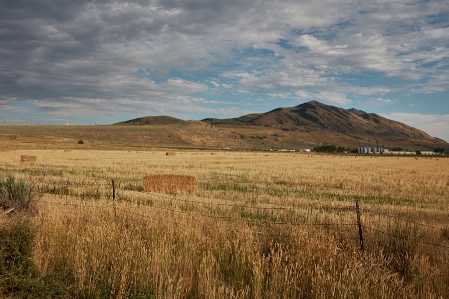 Hay bales dot the landscape near the town of Collinston, Utah, close to the Idaho border
