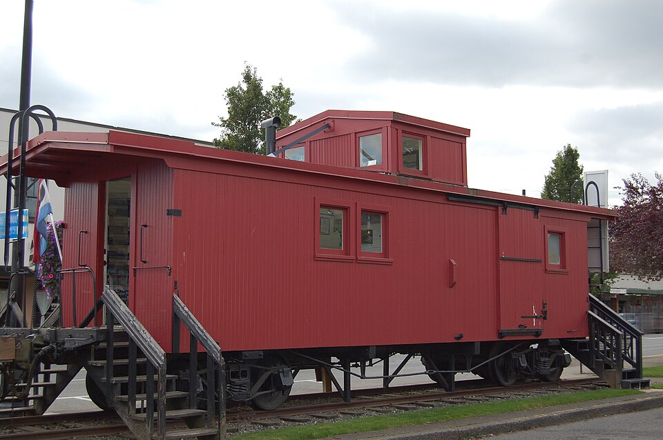 Photograph of Simpson Logging Company Locomotive No. 7 and Peninsular Railway Caboose No. 700